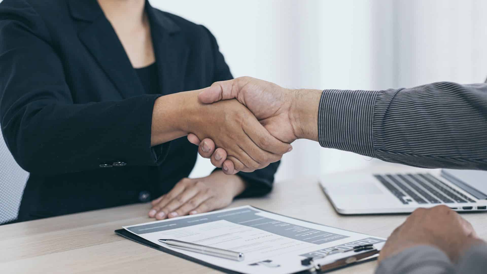 Hiring Manager and Applicant shaking hand after getting the job